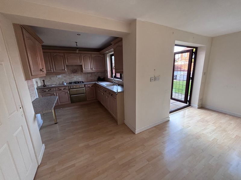 Before renovation kitchen with wooden cabinets and small layout